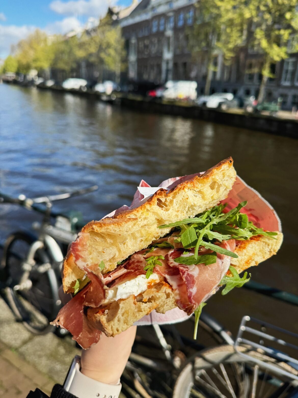 italian sandwich in amsterdam: capocollo. sourdough schiacciata, capocollo di martina franca, mozzarella di bufala, red pesto, rucola, evo
