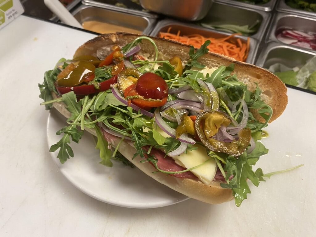 Italian- Speck, Capocollo, Mortadella, Salami, Provolone, Arugala, Onion, Hot Peppers, Mayo, Vinegar