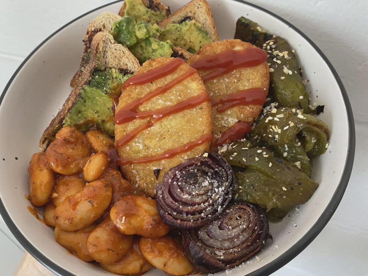 My birthday breakfast assortment, baked beans, roast red onion, grilled capsicum, hash browns, and Vegemite toast w/ avocado.
