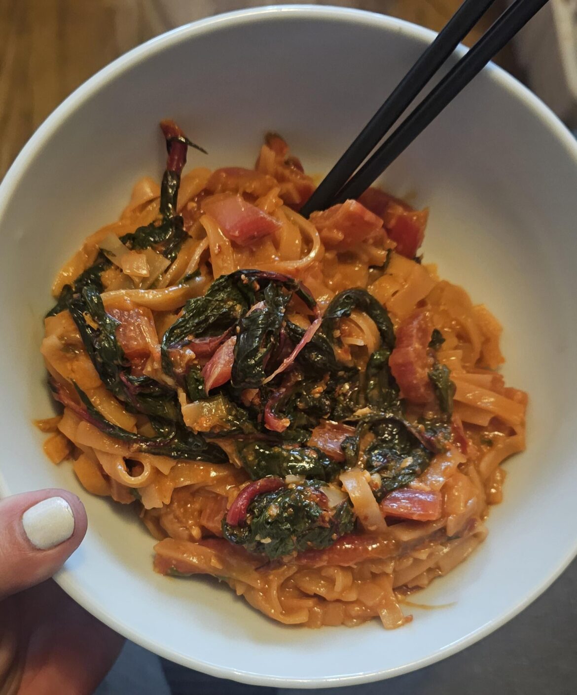 Didn't have gochugang so I used spicy ssamjang, doenjang, sesame oil, gochugaru, soy sauce, ginger, garlic and crispy prawn with chili. Red Swiss chard is the veg and used wide rice noodles.