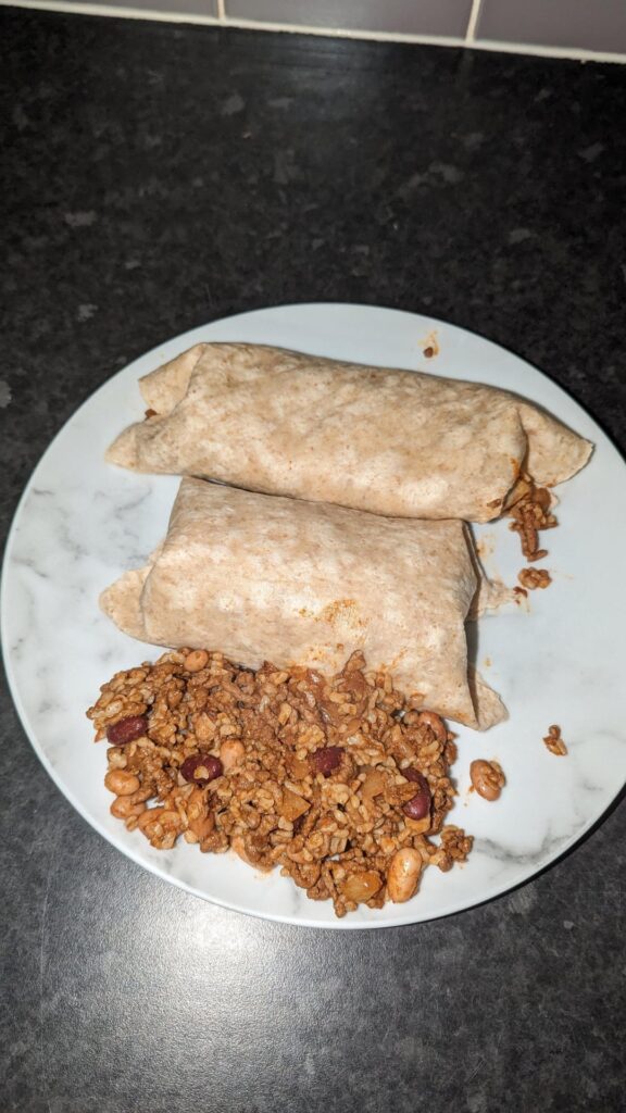 Stuffed cheesy beef, rice and bean burritos - 783cals for two big ones and another burrito worth of beef, rice and beans