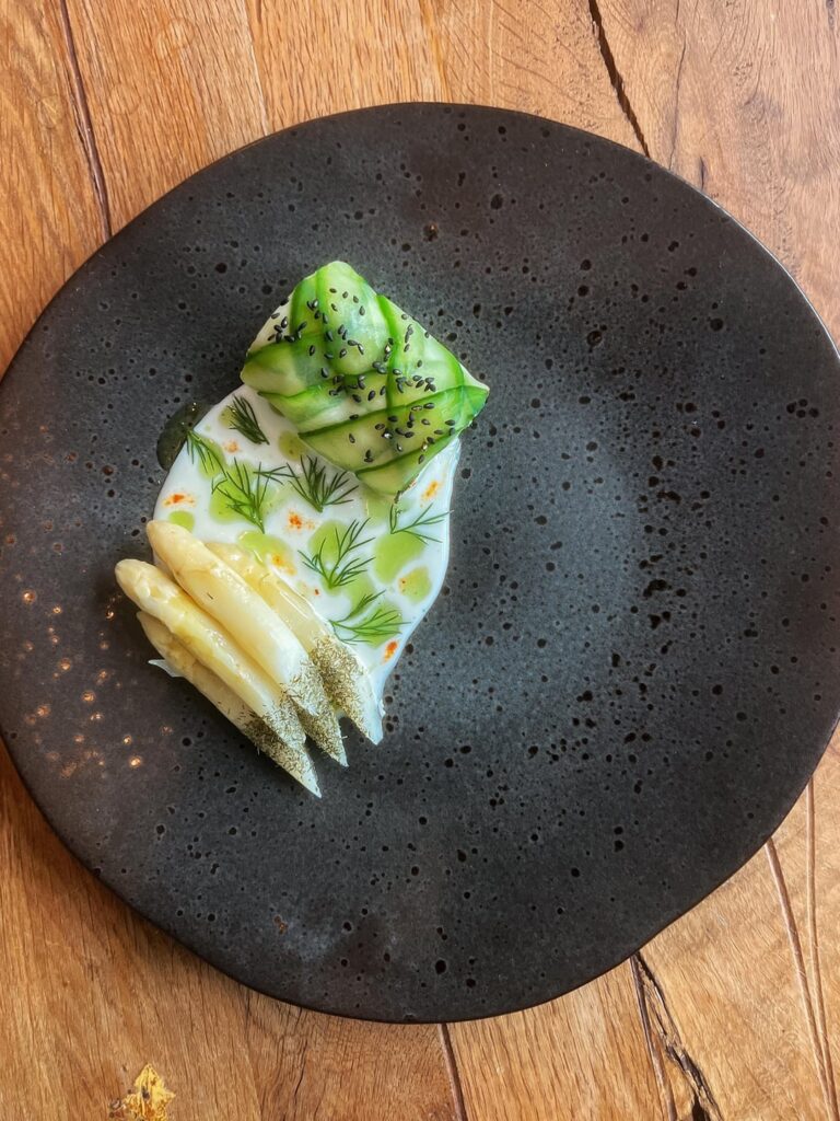 Milk Poached Cod in Cured Cucumber · Cava Veloute with Tarragon/Arugula Oil · Asparagus