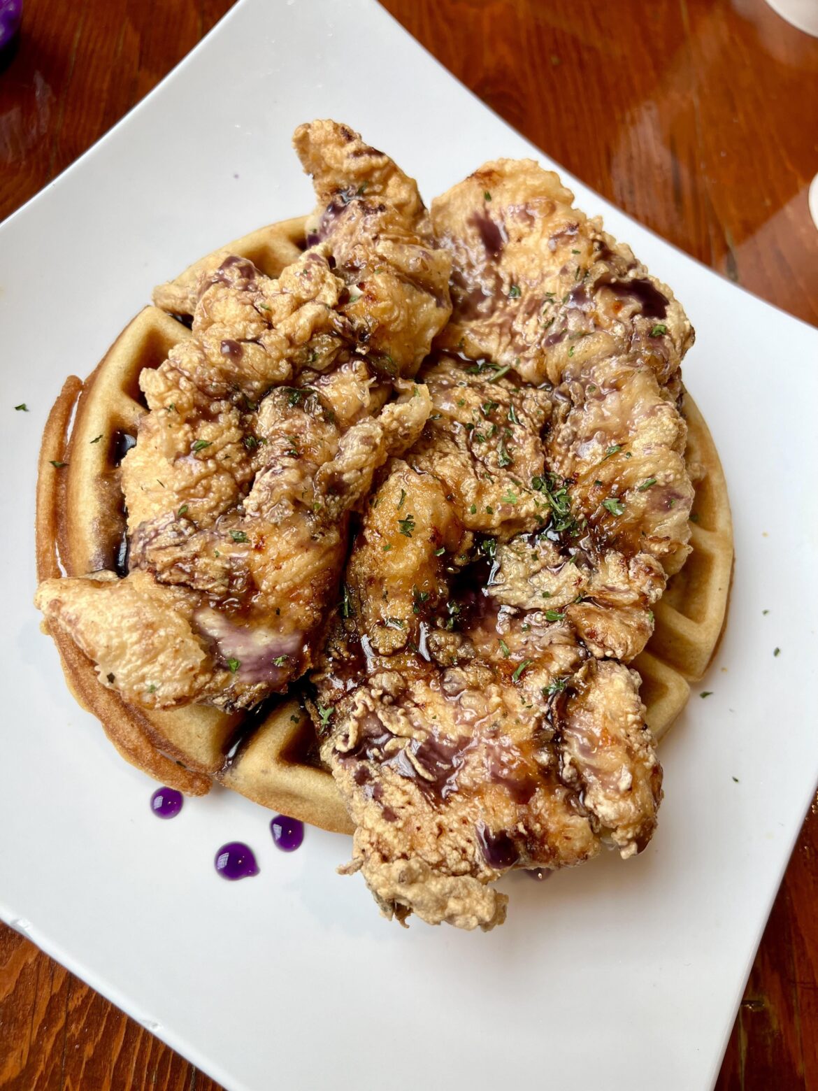 Chicken & waffles with purple ube syrup