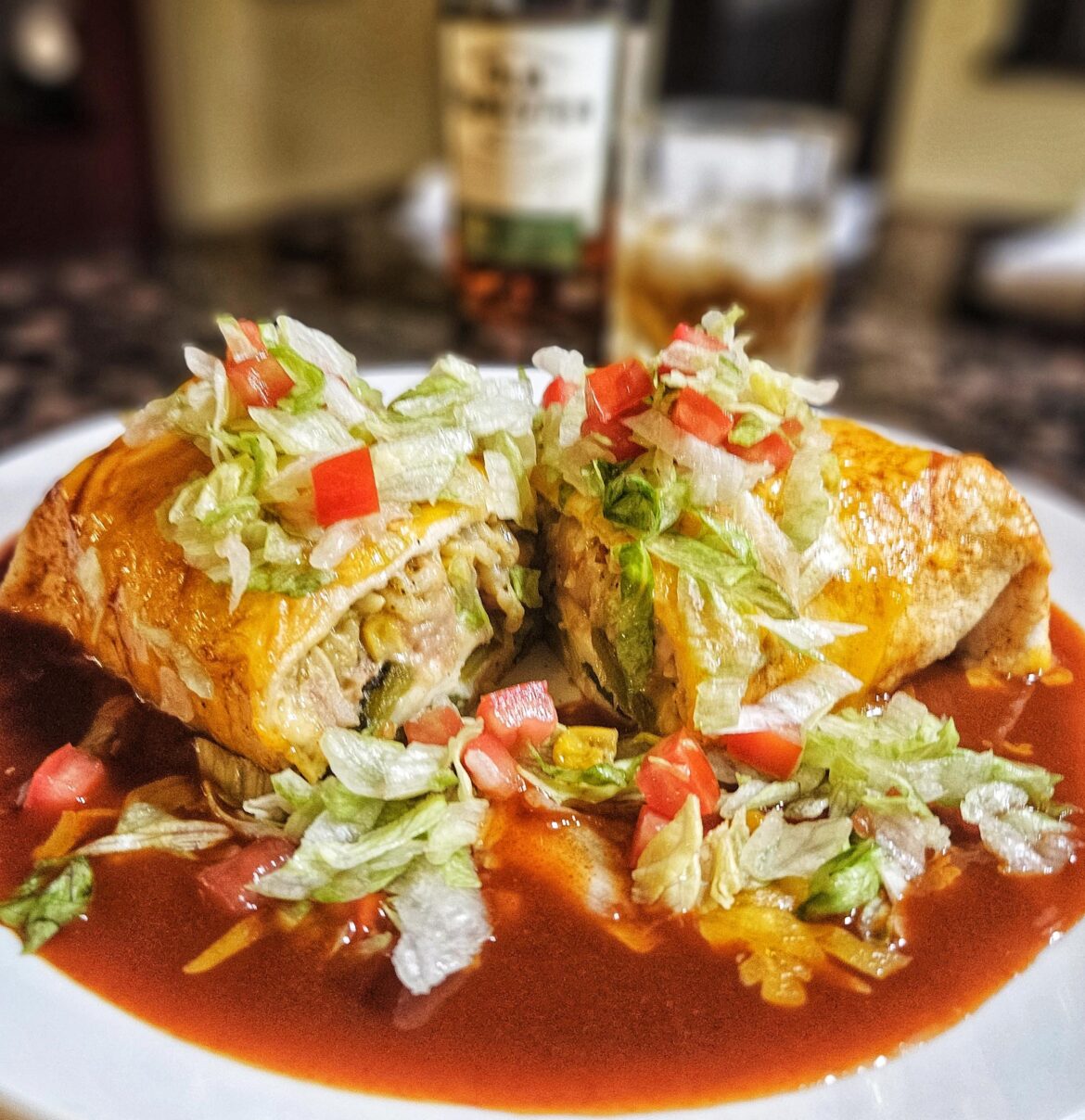 Chile relleno burrito smothered in Hatch red chile with sharp cheddar cheese.