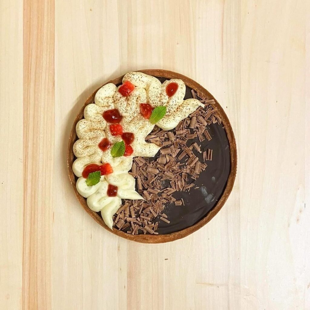 Strawberry & Dark Chocolate Tartelette topped with Whipped Vanilla Ganache