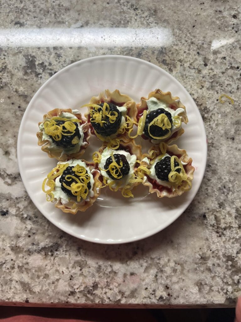 blackberry tart with pear whipped cream and lemon zest