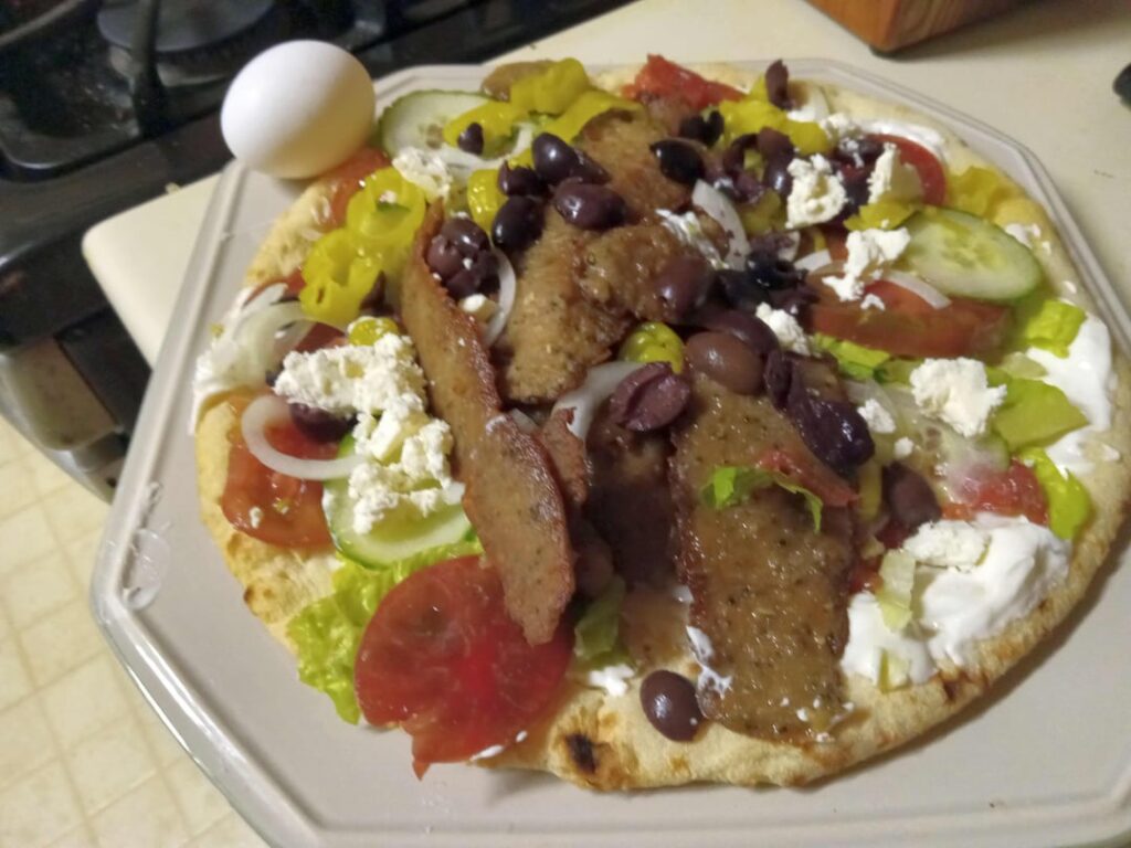 Woke up at 7:00am craving a gyro after 6-7 years without one. Restaurants not open until 11:30AM. Had it delivered by 10:00 AM from Restaurant Depot. Made a 3-pounder using a 12" imported pizza crust. And I have at least 40 more to go. I will never crave a gyro ever again! (egg for scale)