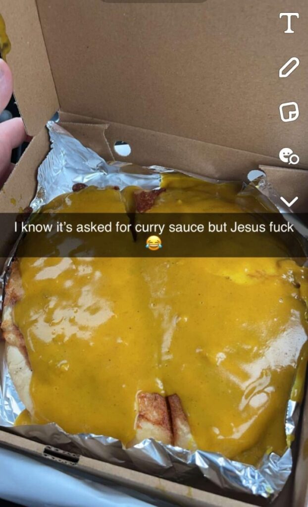 Deep fried pizza with a "splash" of curry sauce from the chip shop 💦