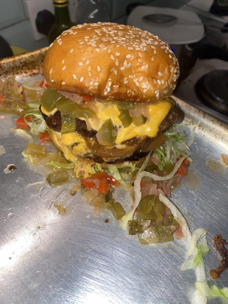 Drunken smash burger with homemade pepper, onion & gherkin relish