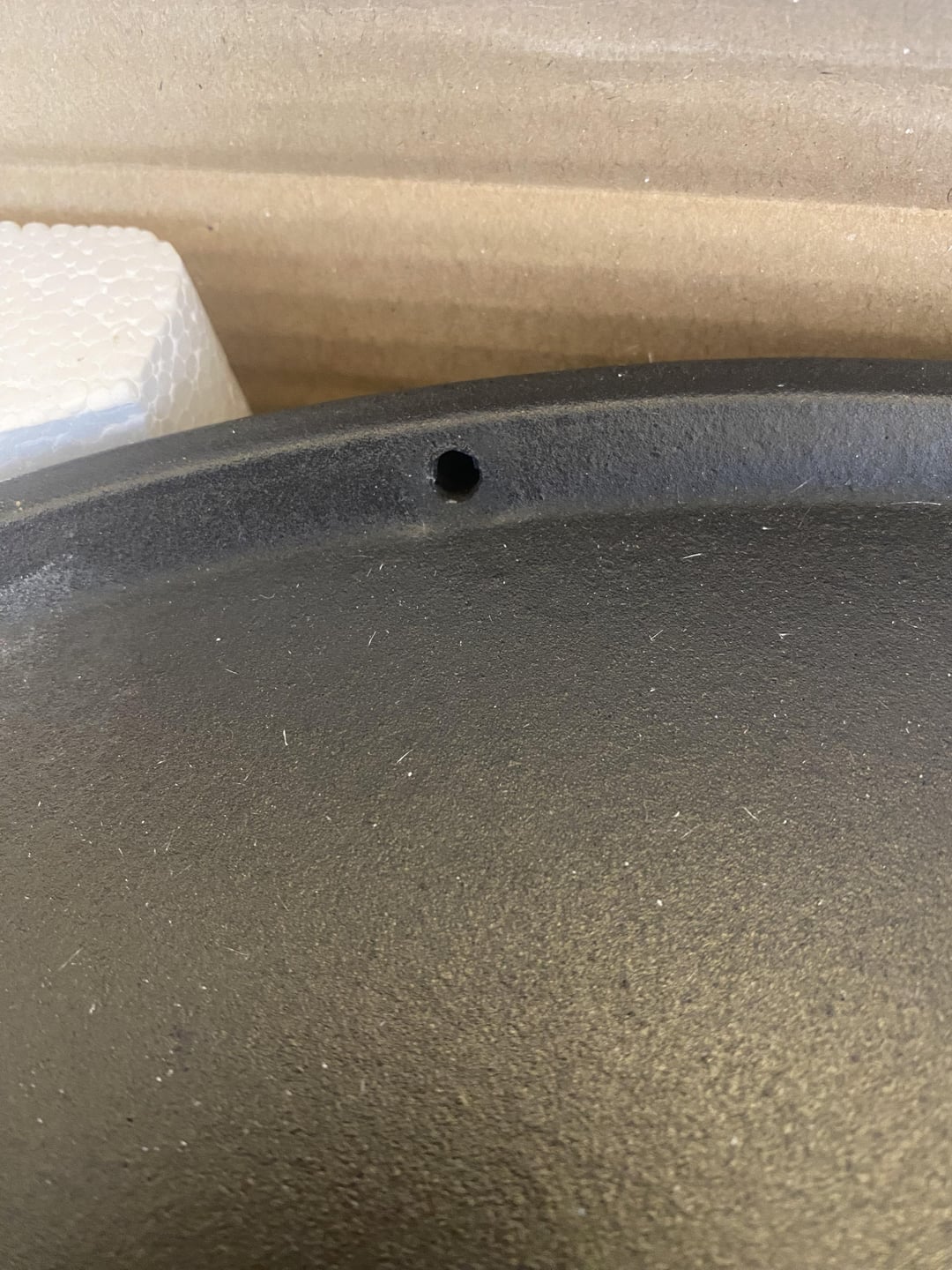 Hole in cast iron half moon? Dining and Cooking