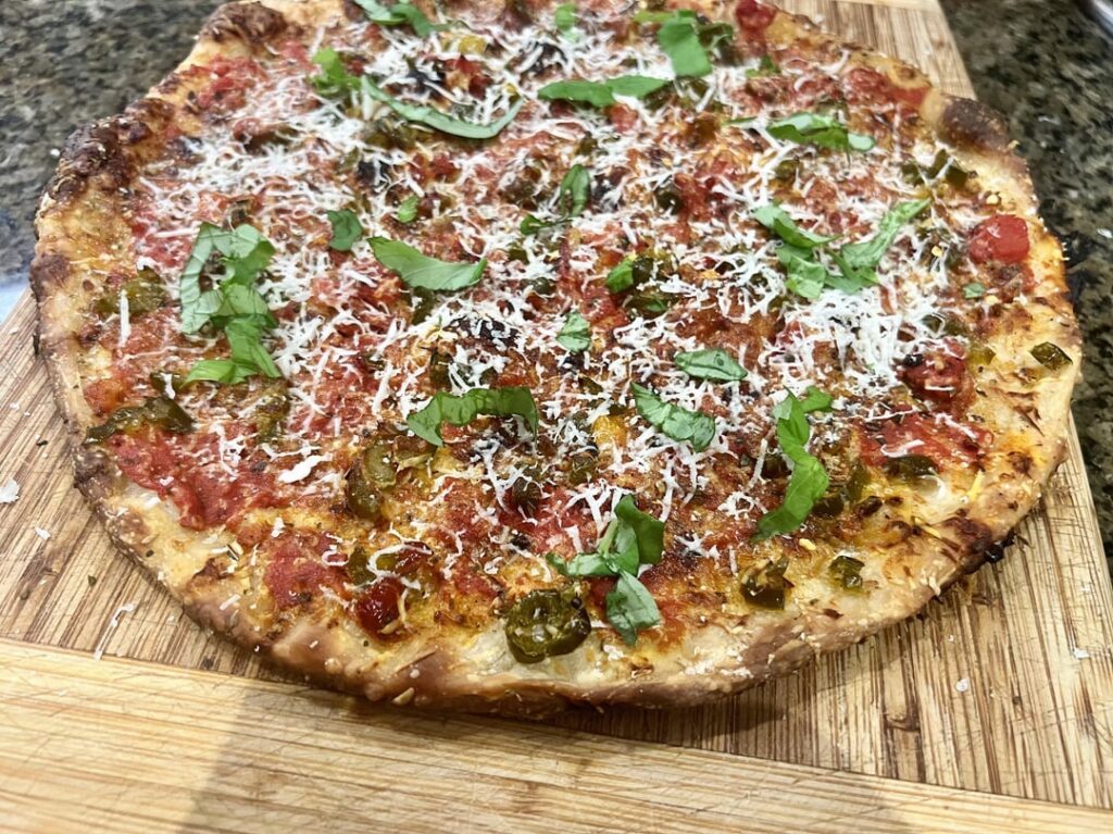 A triple fermentation, no Mozz pizza with San Marzano tomatoes, grated Pecorino and diced hot and sweet jalapeños. Is this a Tomato Pie?