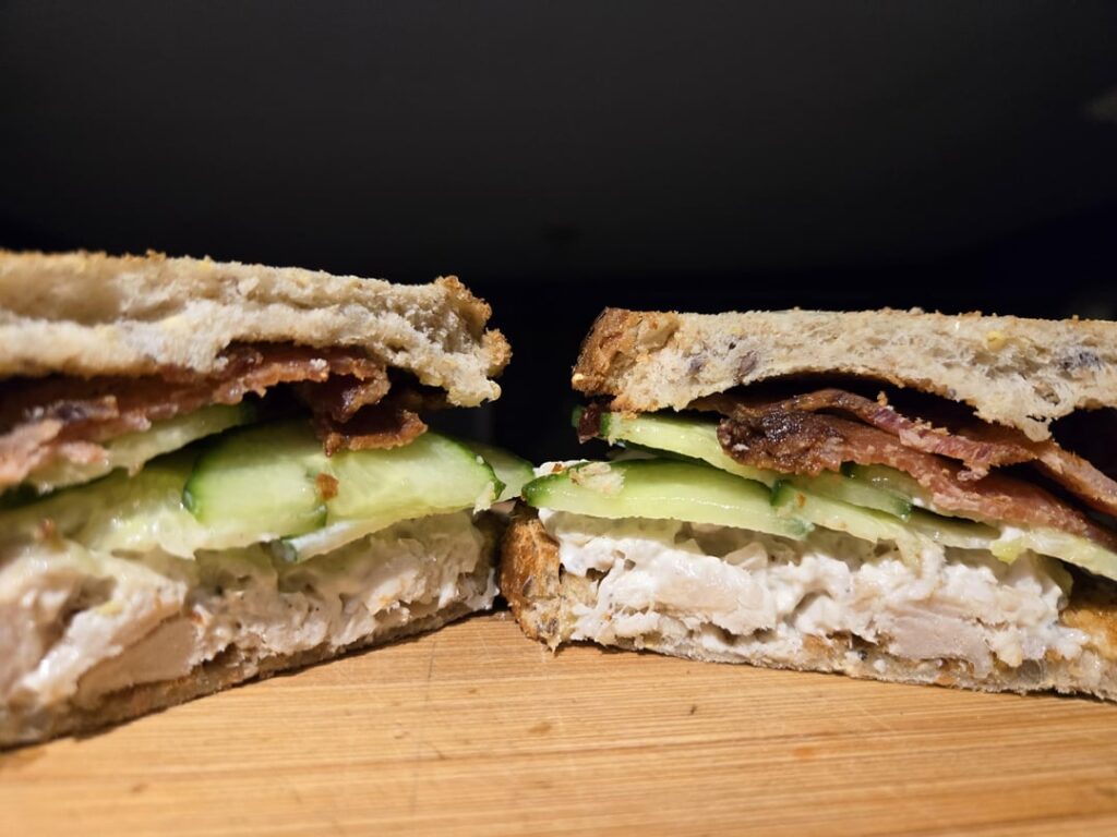 Chicken salad w/ cucumber and bacon. On toasted 9 grain