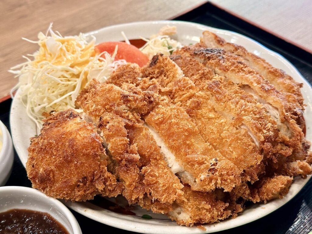 Ordered a $10 katsu meal set, and got this monstrosity. Underneath that giant katsu is another katsu. Double Katsu with 4 sauces!