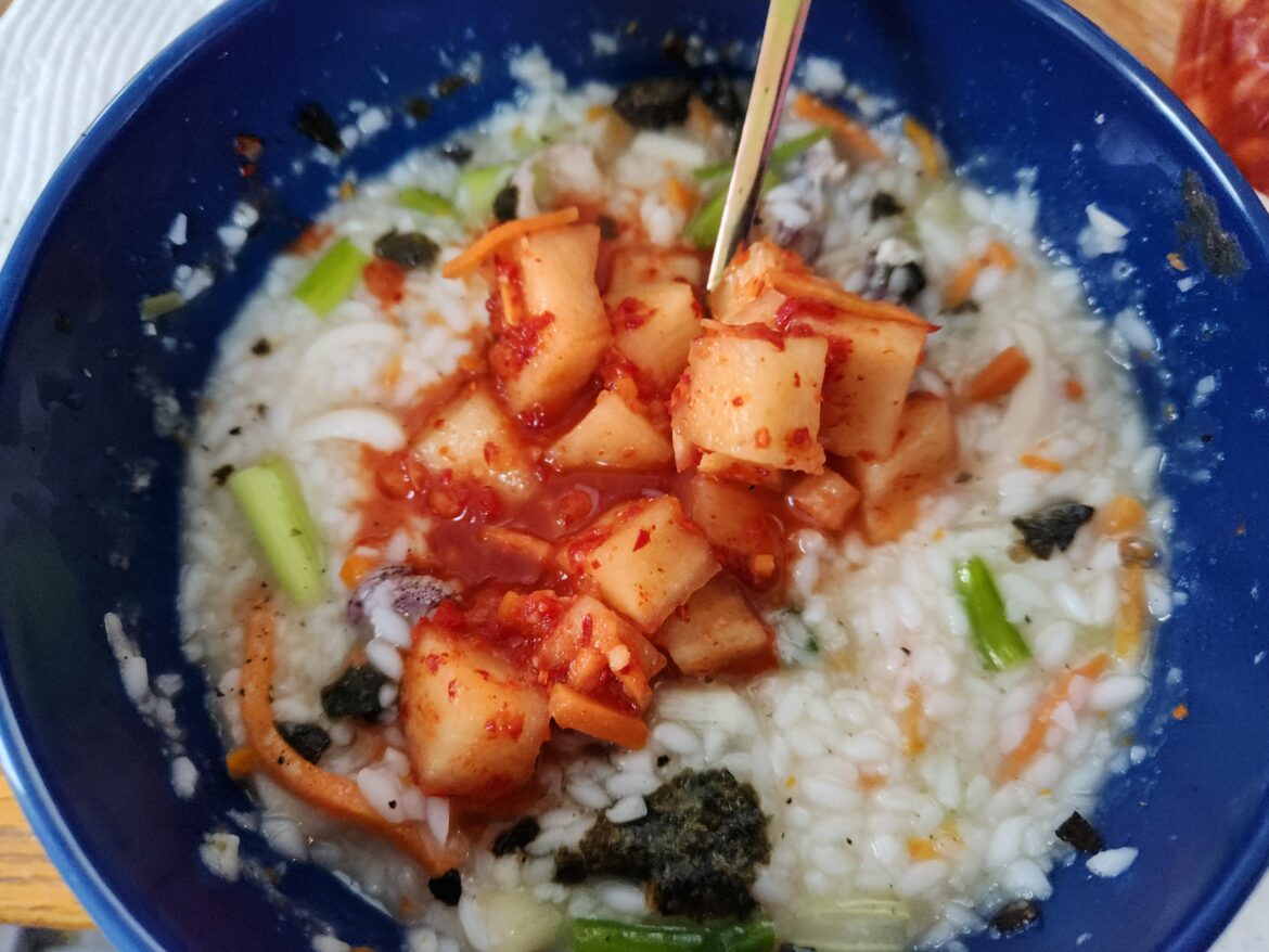 One of my favorite Korean combos. abalone porridge with Kkakdugi kimchi on top........Hot and cold, mild and spicy