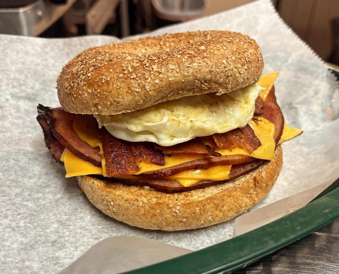 Toasted Bagel, Canadian Bacon, Bacon, Cheese, Over-Easy egg, avocado crema & mayo