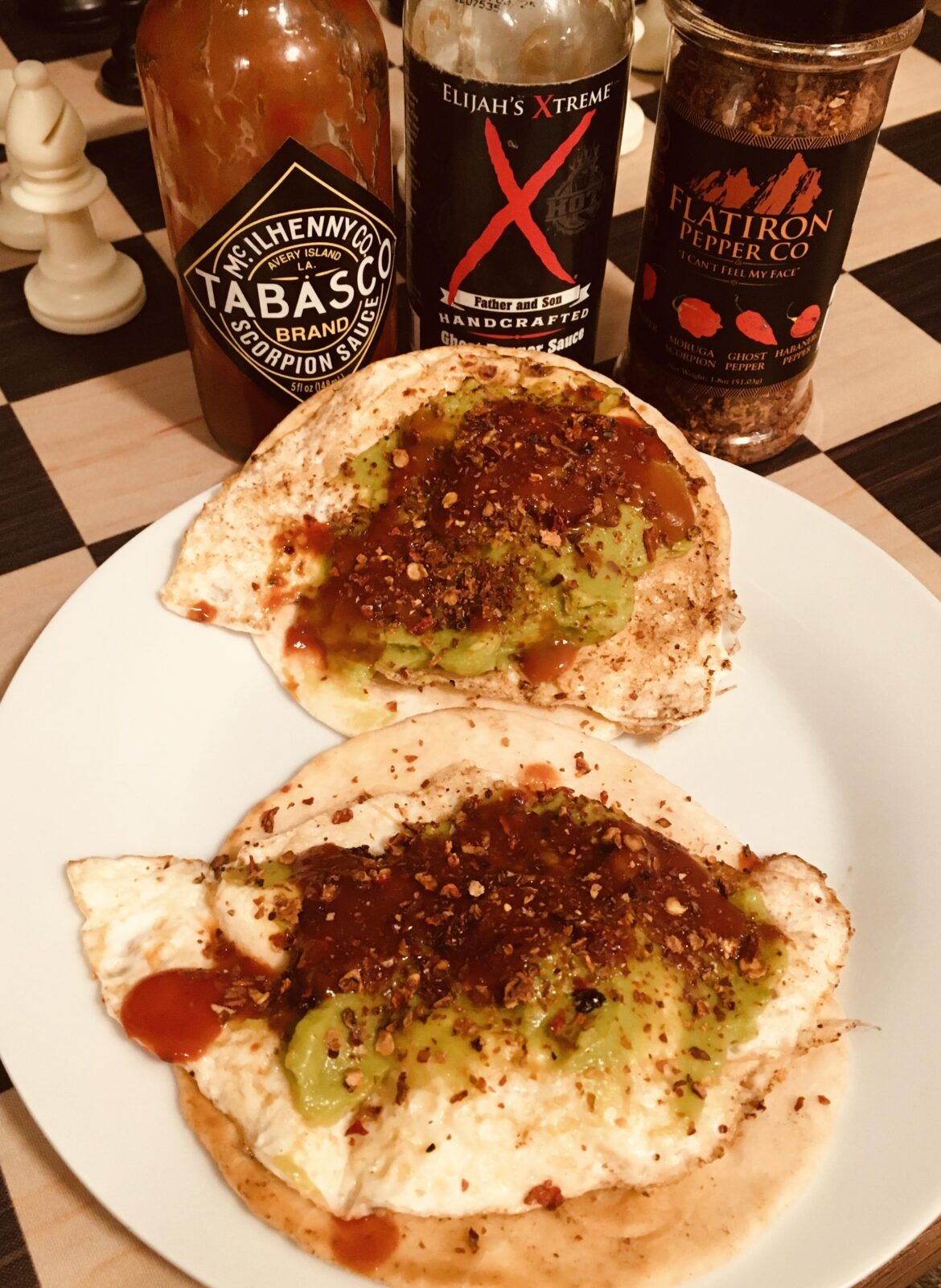 Tortilla, gooey fried egg, guacamole, hot sauce, chile flakes. Simple but delicious.