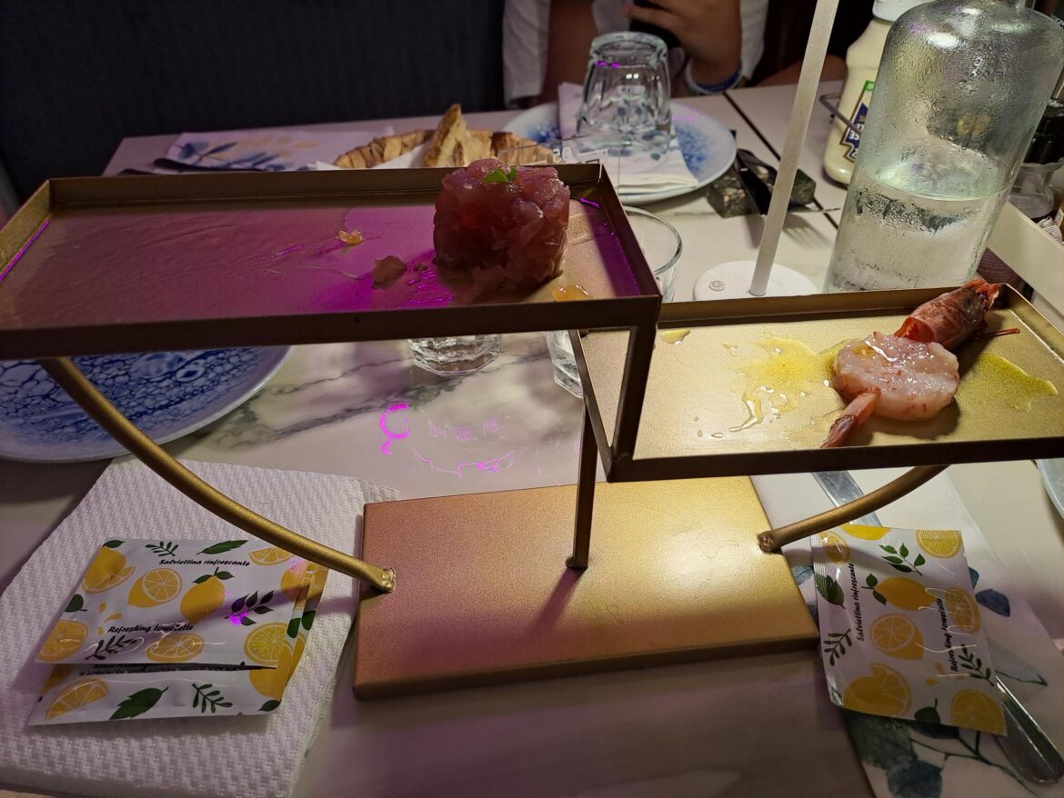 Tartare on a... idk a platform designed by Dalì? Everyone else got plates thoug