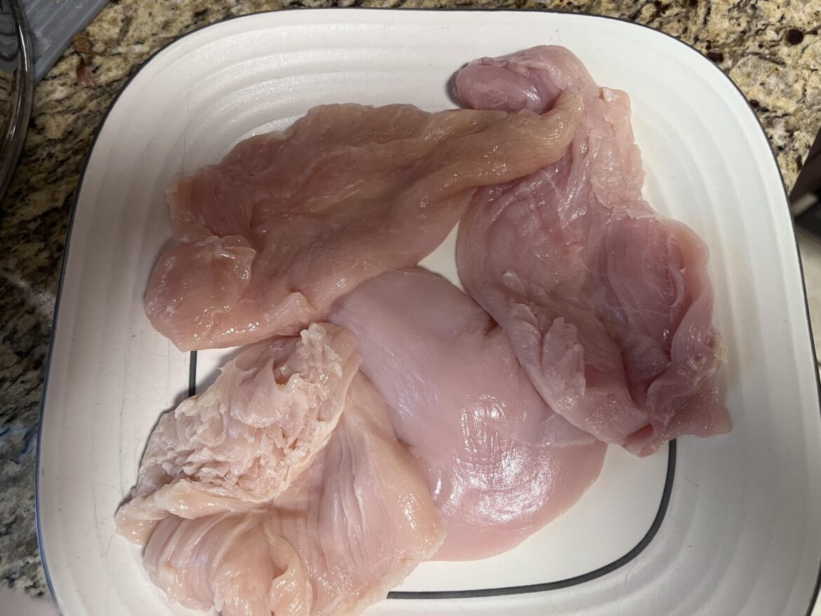 Who is cutting this chicken?
