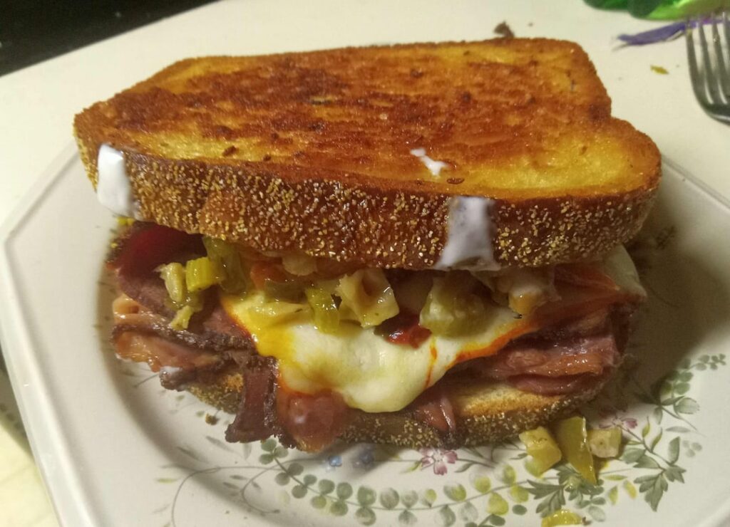 The Rupert - Reuben's double exiled half-brother: Pastrami, muenster cheese, olive giardiniera, and horseradish sauce, on butter-grilled seeded light rye (2 shitty pics - they had to be kiestered and smuggled onto the Internet)