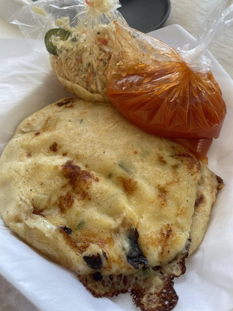 Noticed some ladies in my neighborhood making/grilling pupusas in their front yard. Picked up 2 for $3 each.