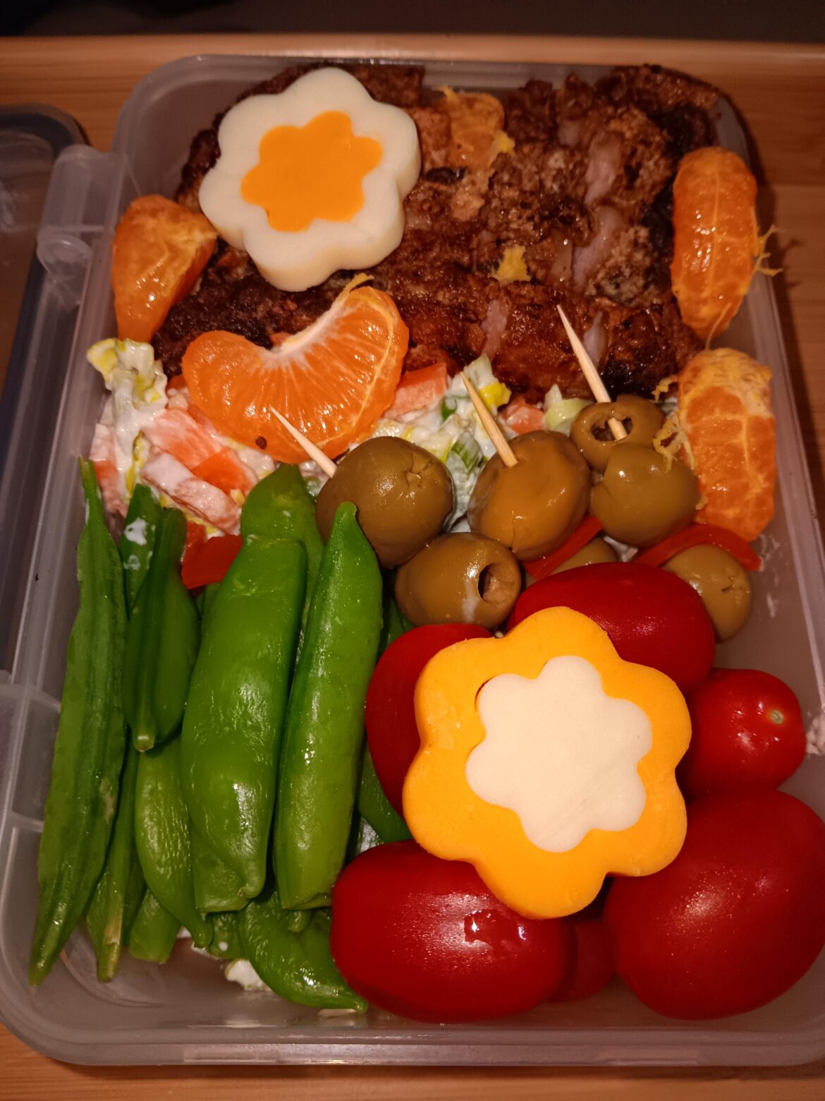 Tonight's bento - Deep fried pork (it it really tonkatsu when you're out of panko?) on a bed of salad w/ "stuff"