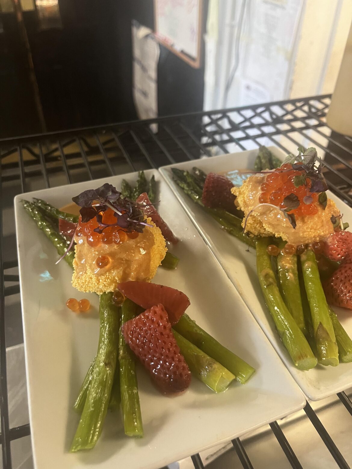 Roasted asparagus, deep fried poached egg, lobster hollandaise, smoked salmon roe, pickled strawberries