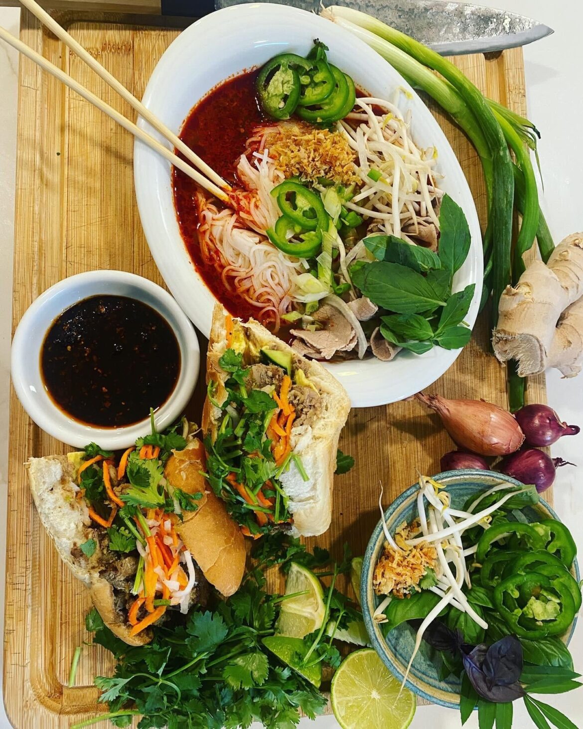 Homemade spicy beef pho and lemongrass grilled pork belly bahn mi