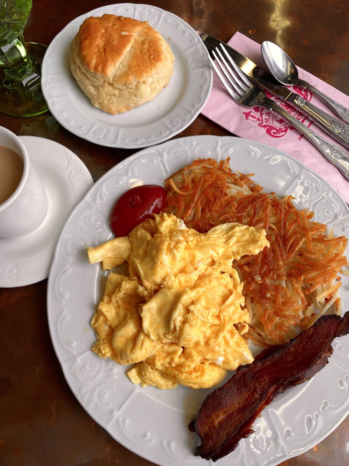Scrambled eggs, bacon, hash browns, and biscuit at Madonna inn