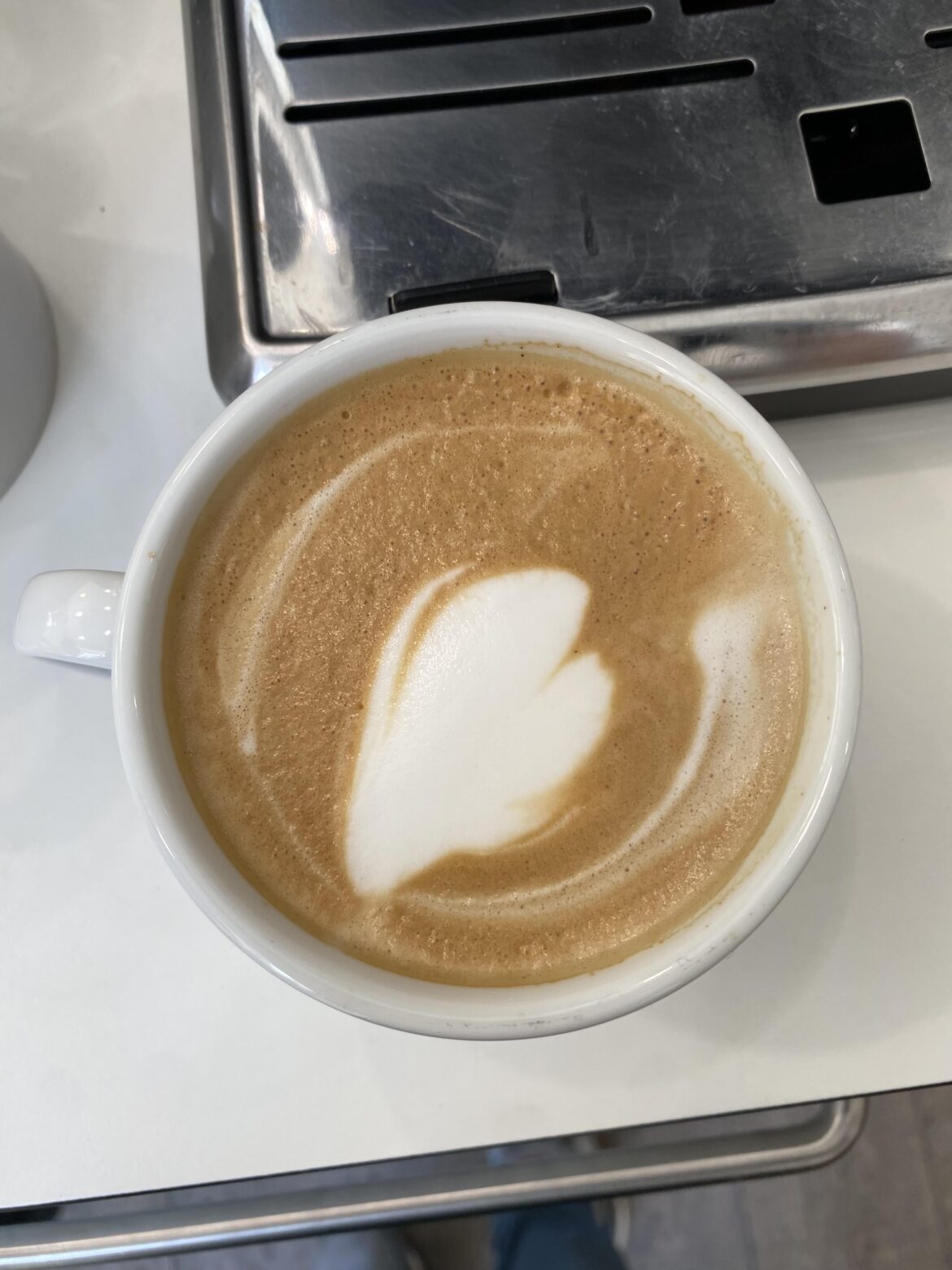 Can someone help me with my latte art hearts? What am I doing wrong?