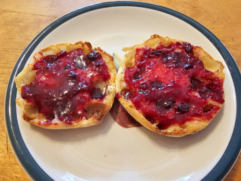 Foraged enough black cap Raspberries to make a batch of jam. I had to can it outside on my camp stove because it's too hot to do it indoors.