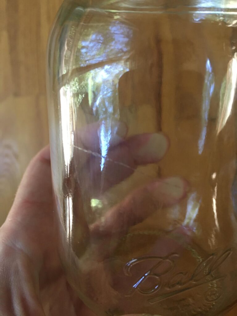 Slightly cracked glass in jar, safe to eat jam?