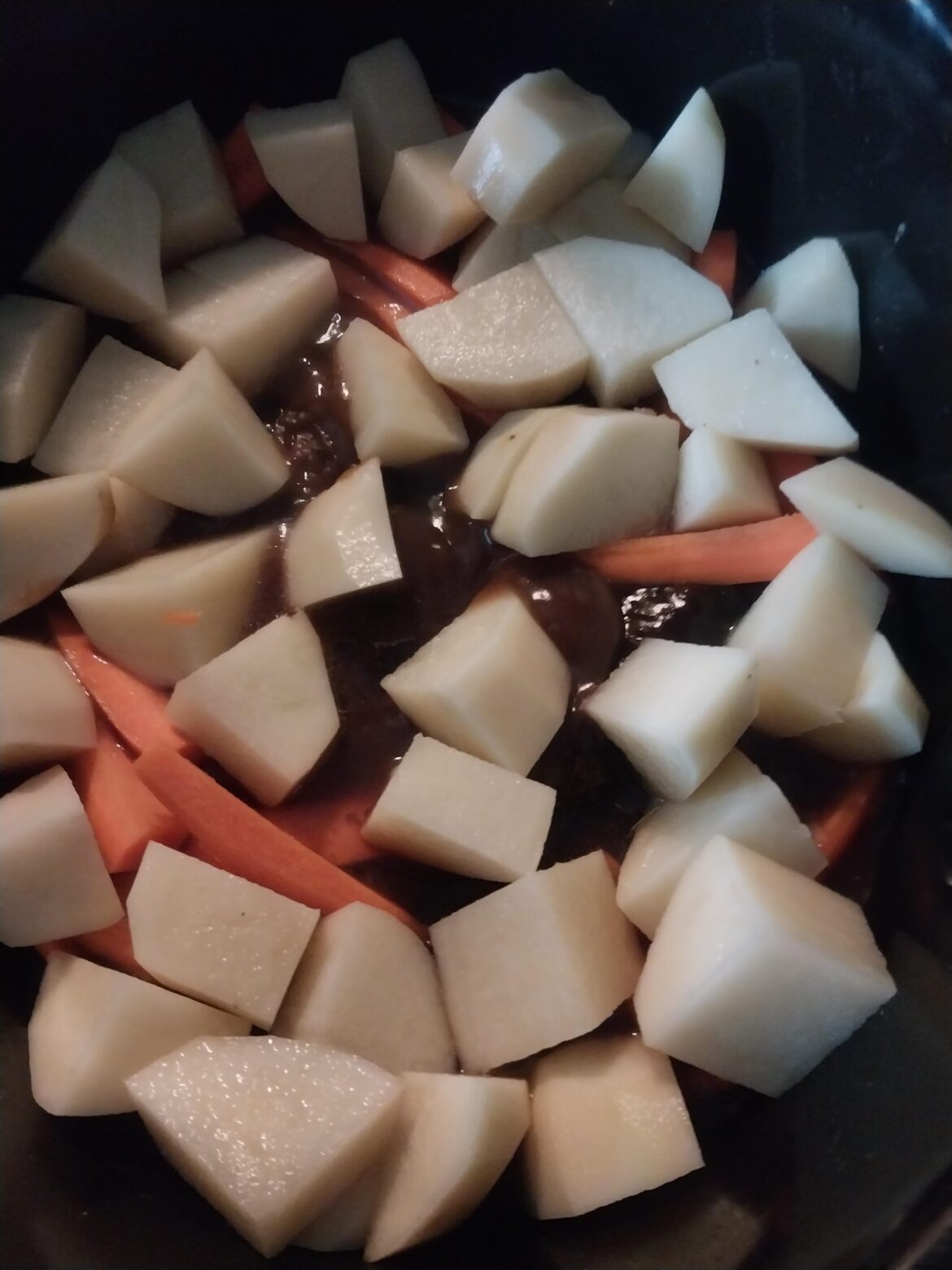 Heading to the golf course for 18. Put 2 lbs of chuck steak in gravy on low 4 hours ago. Just added the carrots and potatoes. Should be a hearty meal when I return from the links.