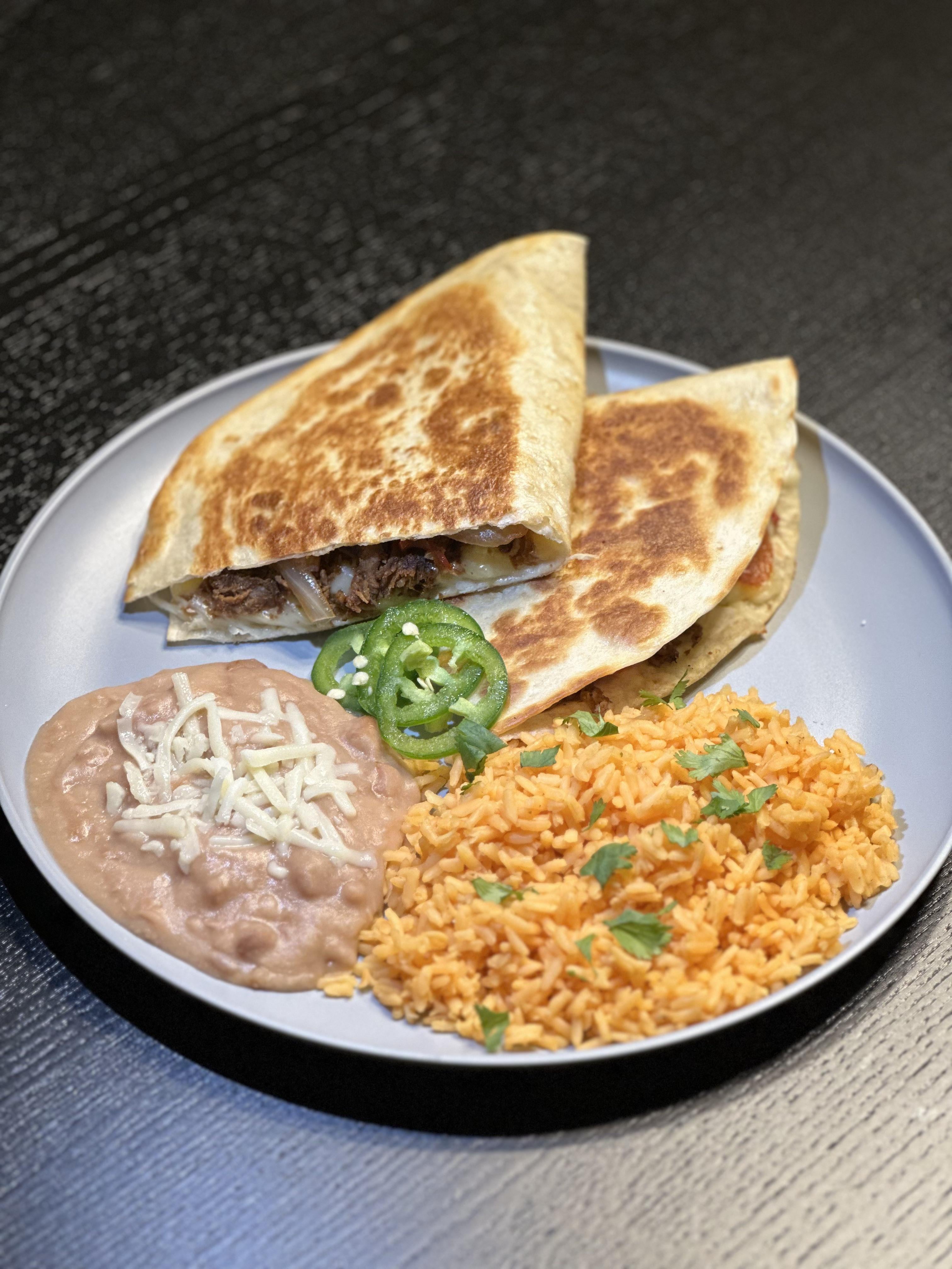 Steak fajita style quesadilla, rice and refried beans Dining and Cooking