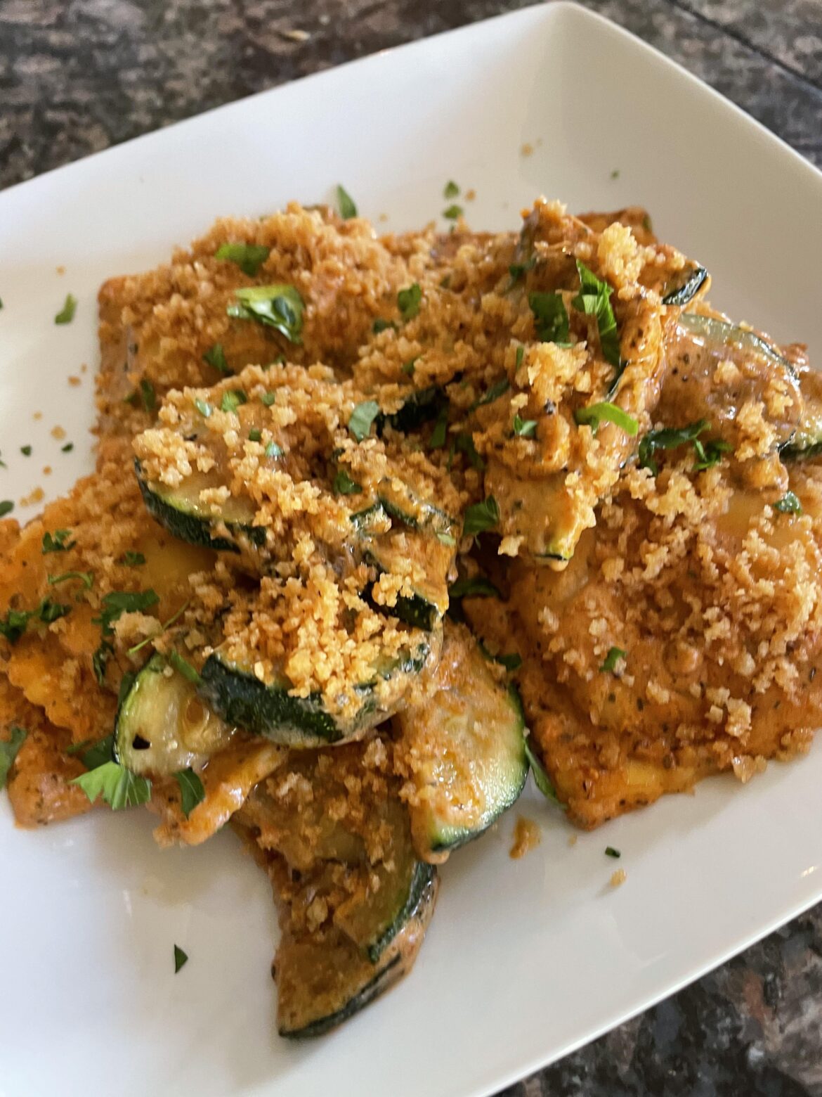 Ricotta tomato ravioli with toasted panko and lemony zucchini. YUMMY and a nice summer dish.