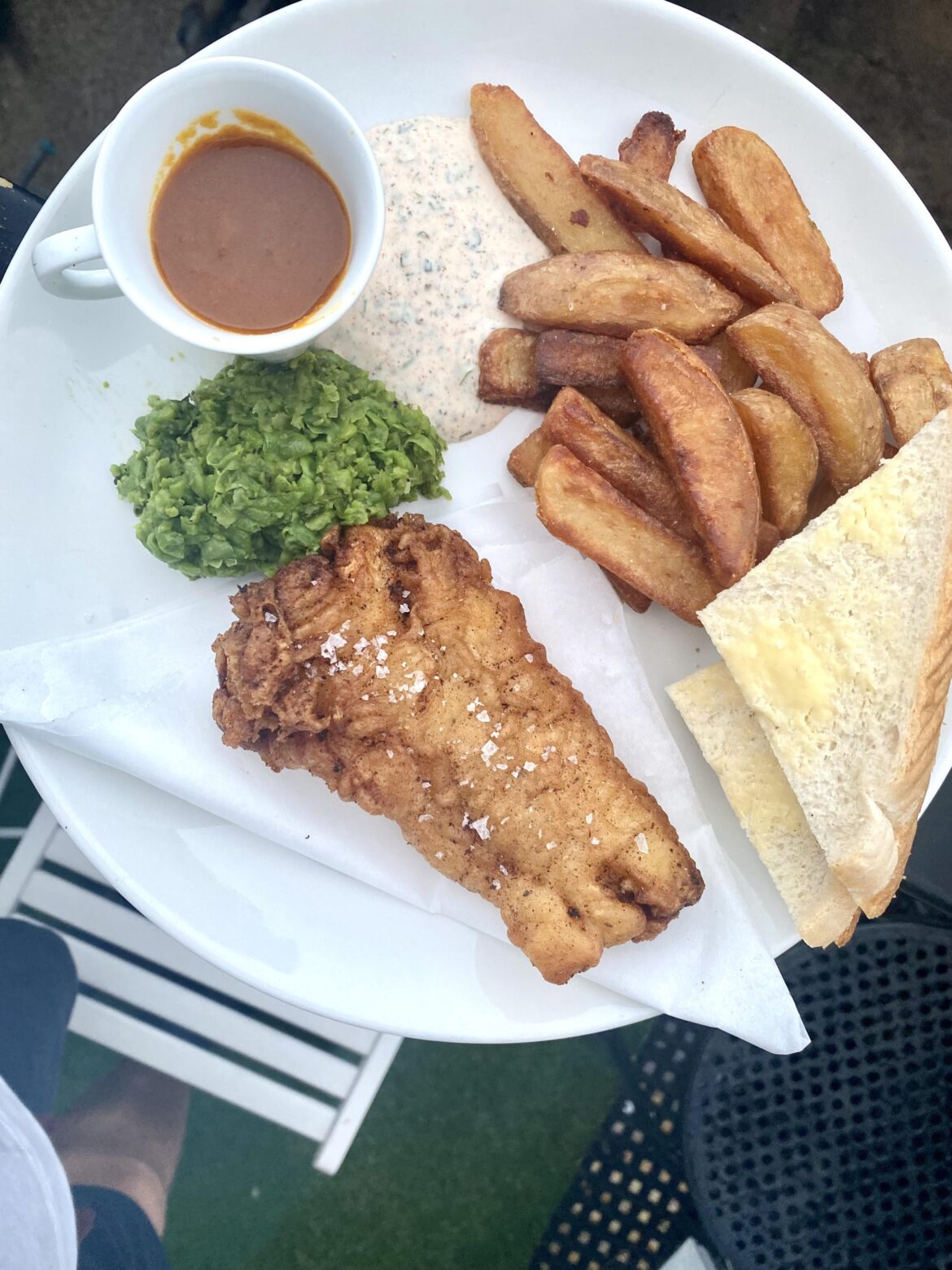 Homemade fish and chips, with mushed minted peas, curry sauce & tartar sauce