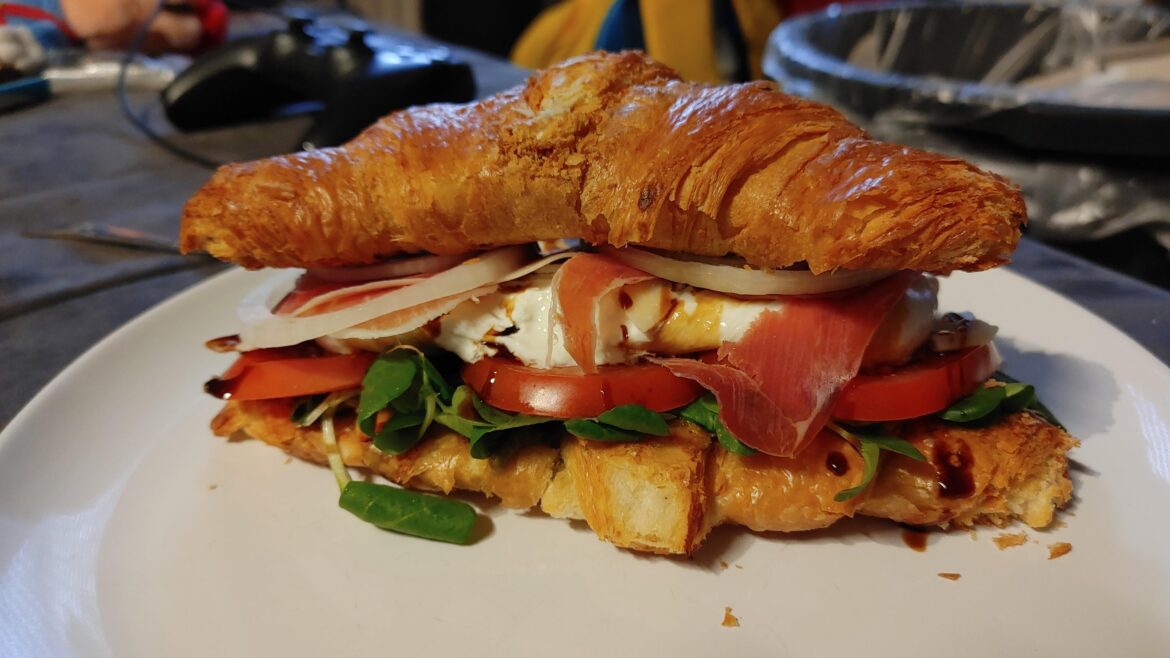 Croissants, Pesto, salad, tomatos, Mozzarella, serrano,Parmesan, onions and another Croissant