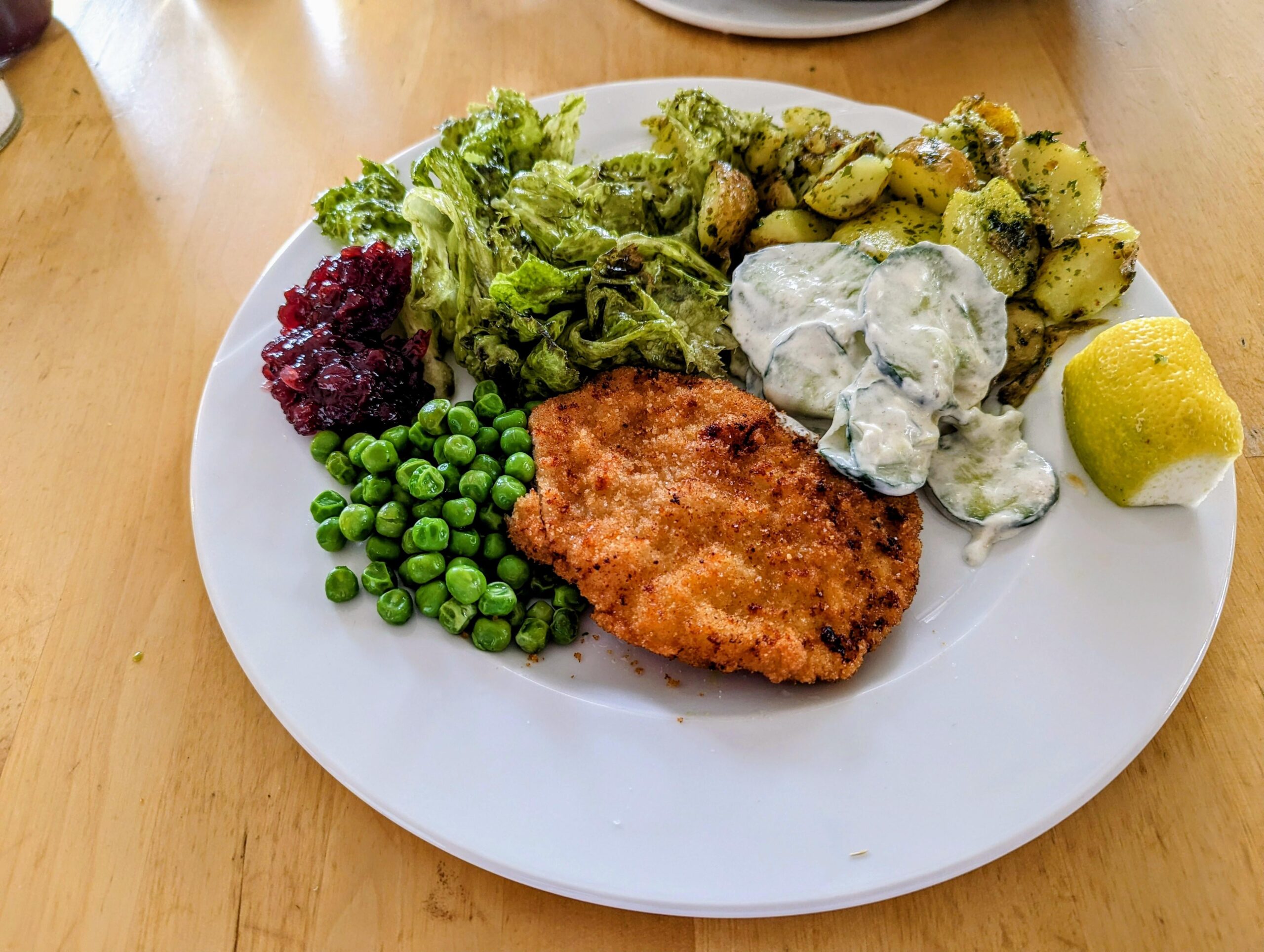 Wiener Schnitzel (homemade) with parsleypotatoes, green salad with