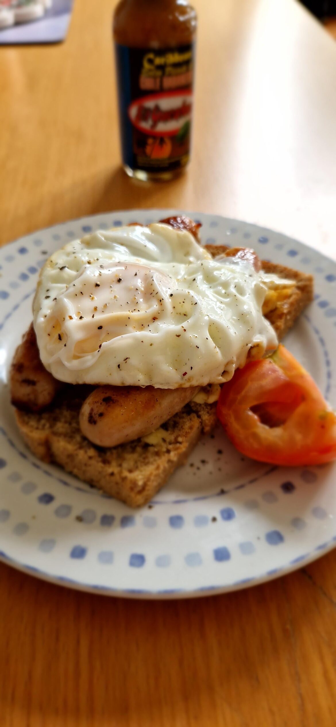 Egg on brown bread with sausages