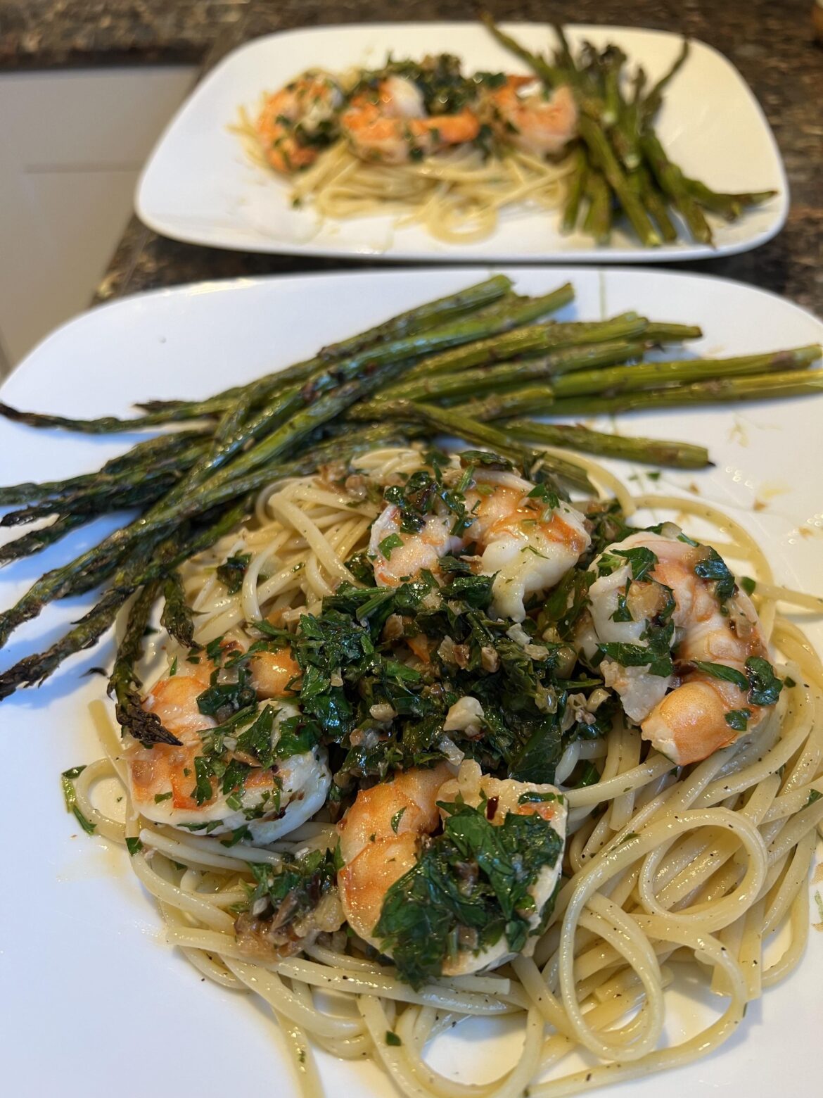 Shrimp scampi over linguine