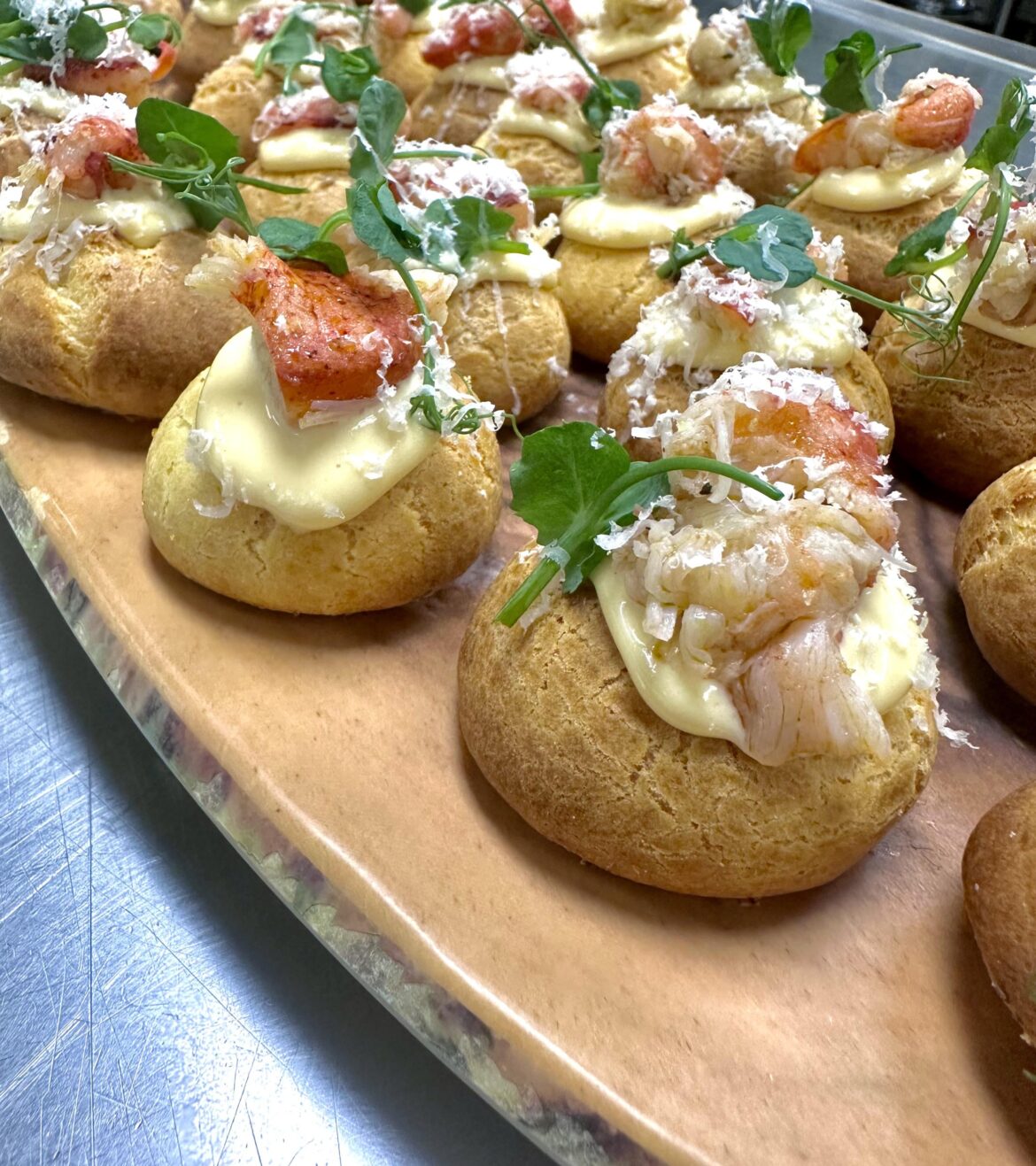 Gougères - poached lobster, béchamel, preserved lemons, gruyere cheese