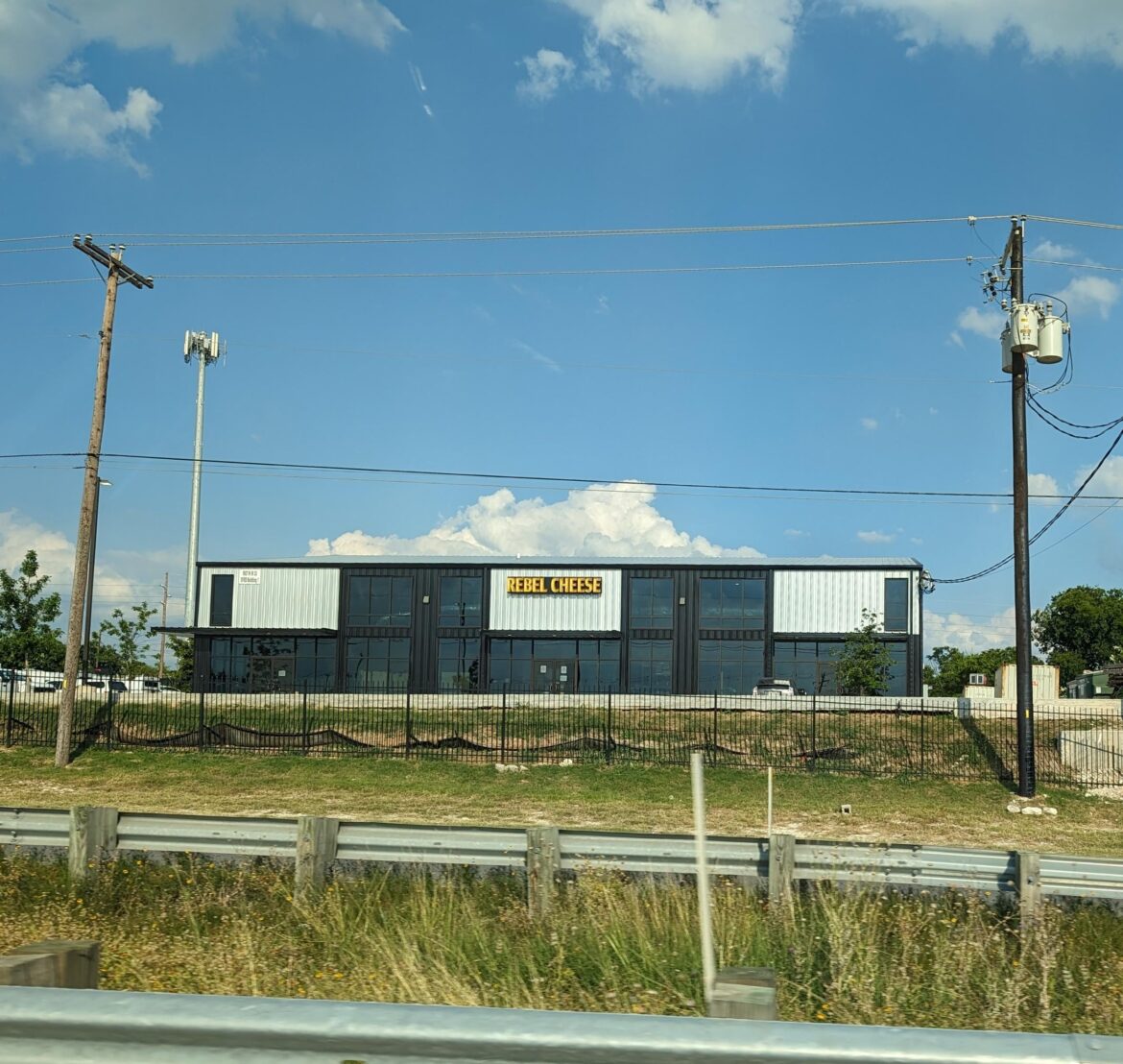 Rebel Cheese going up on I-35 and Rundberg