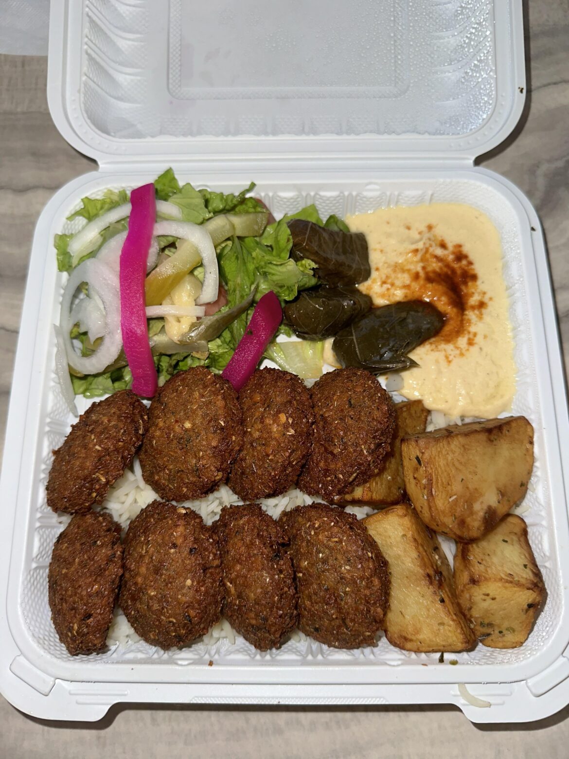 Falafel platter! (I got extra tahini, garlic, and chili sauce on the side)