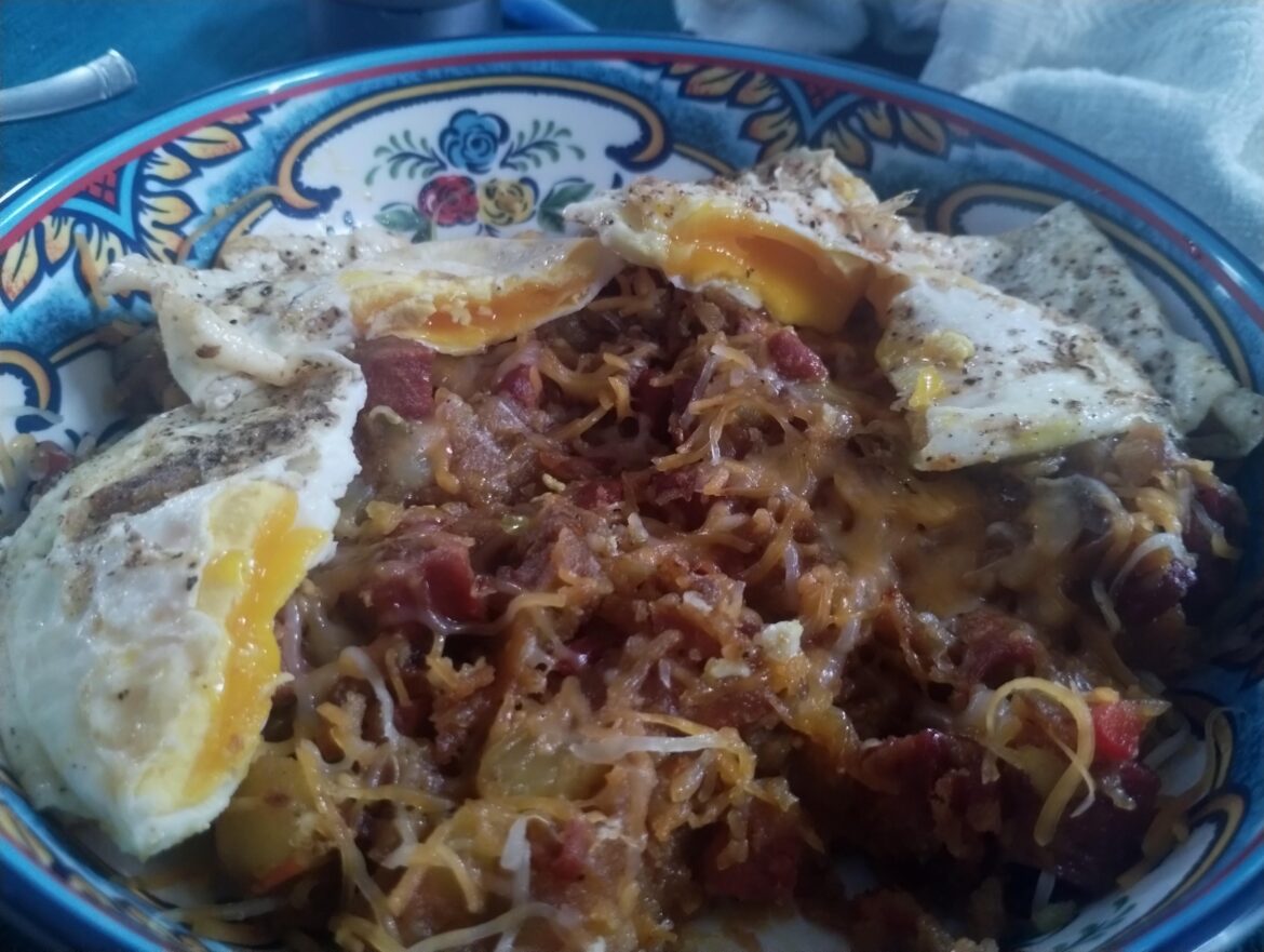 Breakfast hash browns with over medium eggs