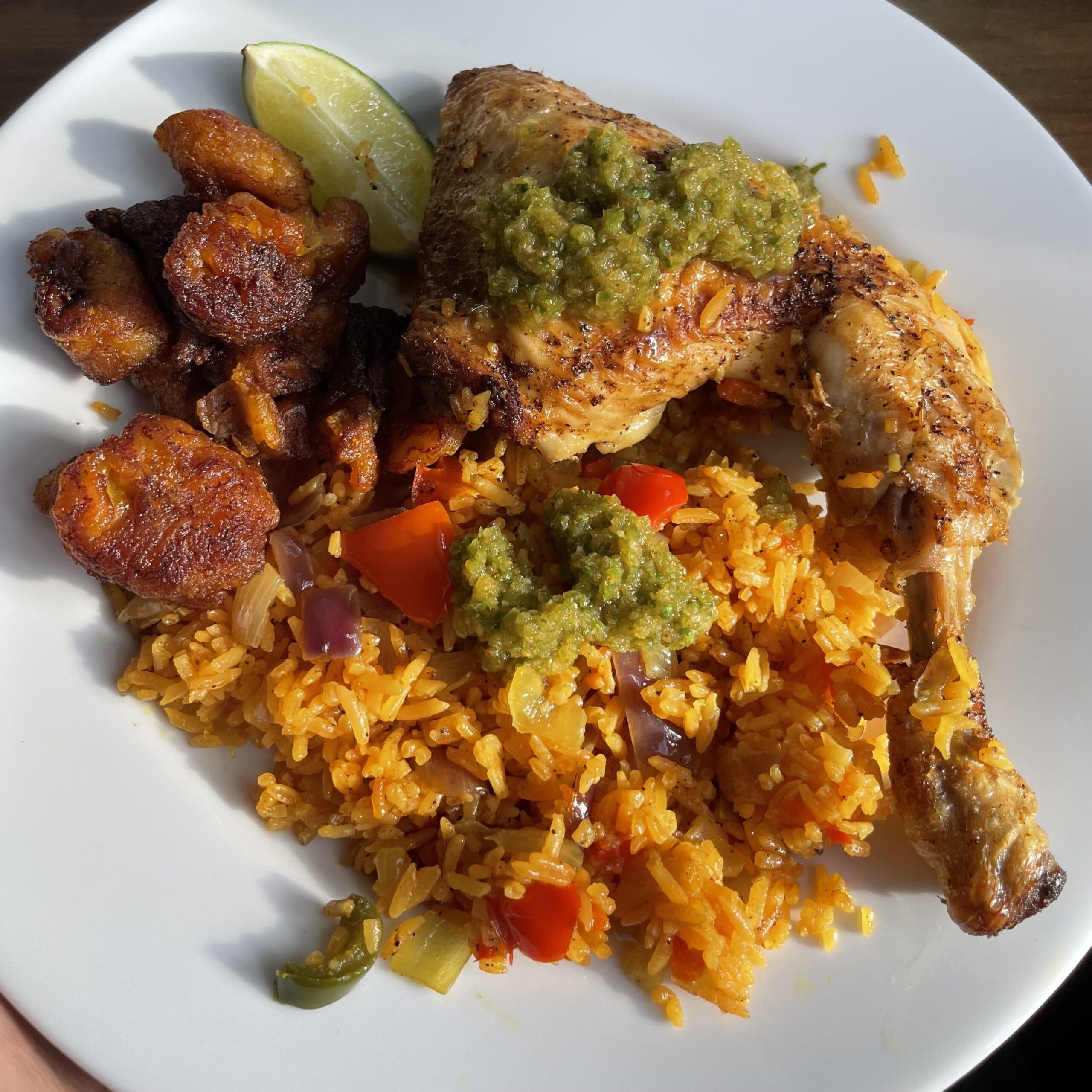 Chicken and rice with fried Plantain and Sofrito in Berlin Dining and