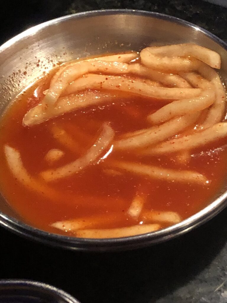 Help identifying this side dish! It’s sweet and I know the sauce is some kind of vinegar and sugar mix but I don’t know what. Assuming this is Daikon or Korean radish?