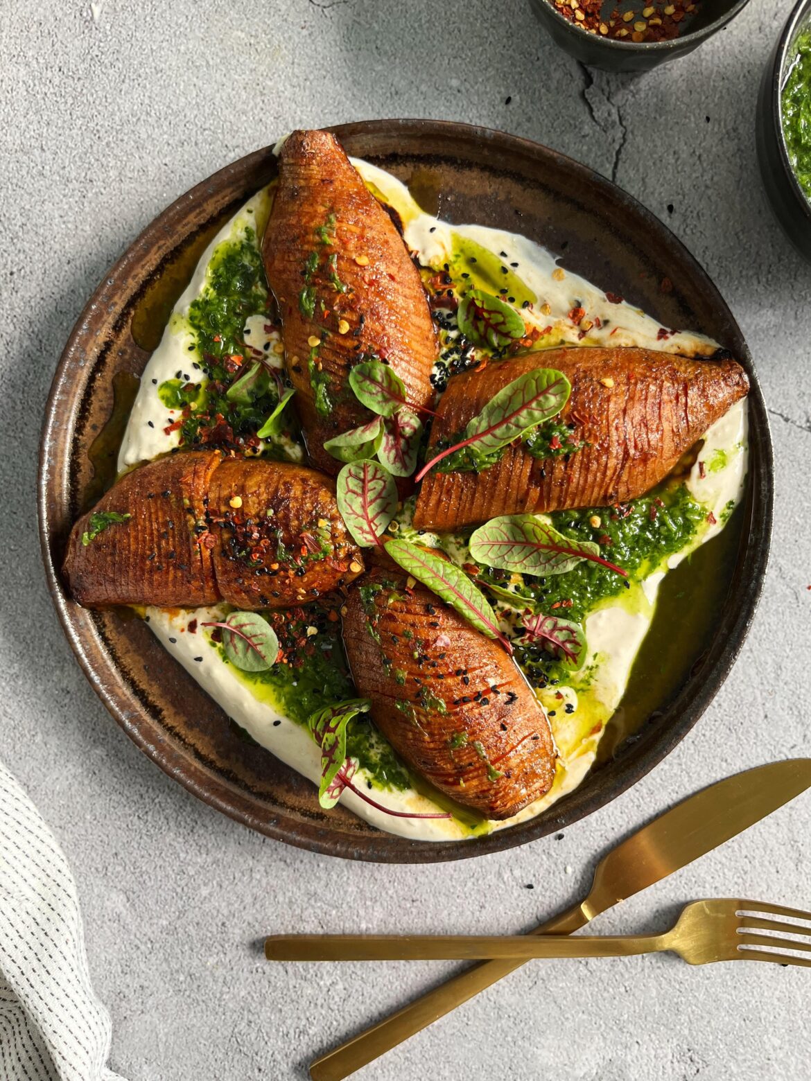 Hasselback Sweet Potatoes with Garlic-Yogurt Sauce and Herb Oil