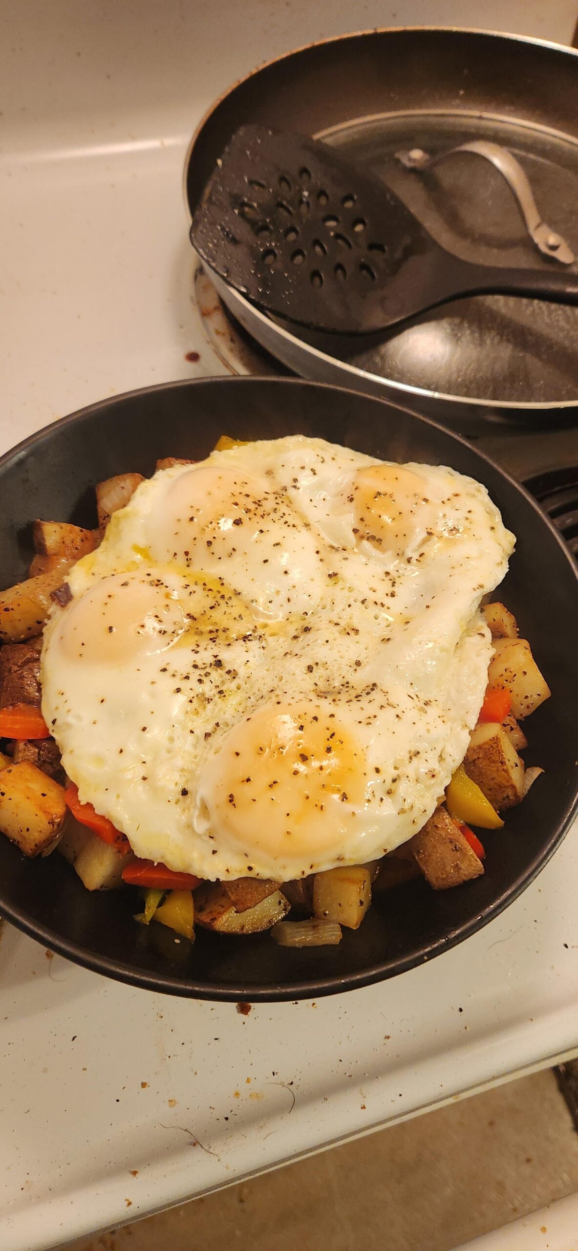 Potatoes O'Brien with four fried eggs Dining and Cooking