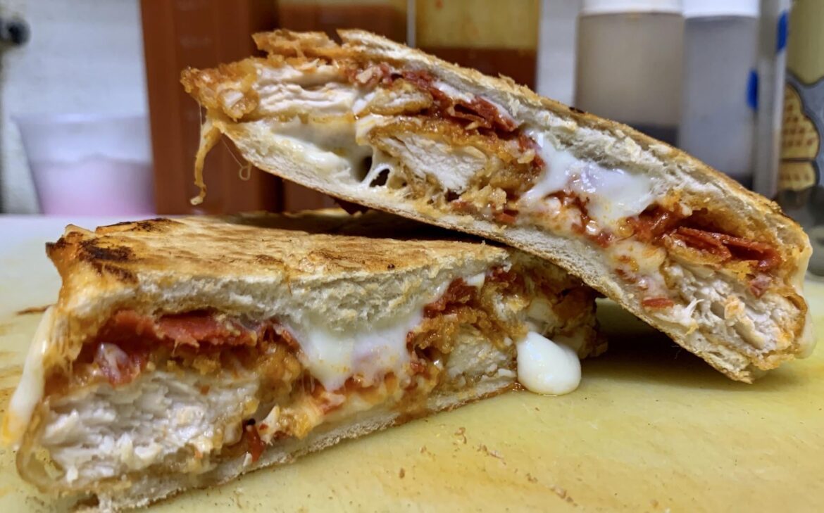 Pressed chicken parm with shredded pepperoni.