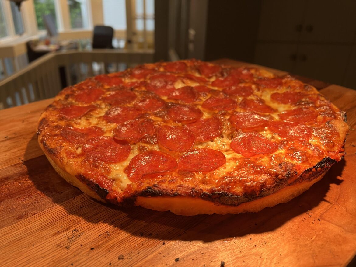 Kenji’s foolproof pan pizza dough, cooked in a Lloyd pan, in a steam oven. Sausage and pepperoni.
