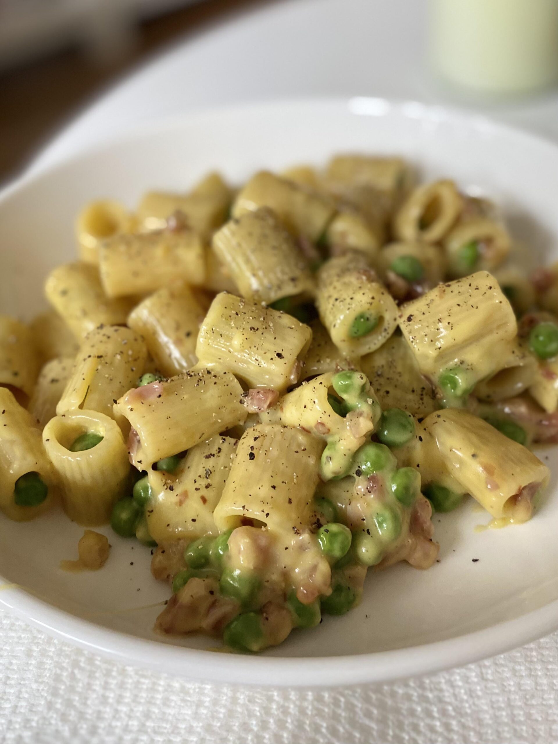 Homemade rigatoni carbonara with pancetta and peas. Dining and Cooking